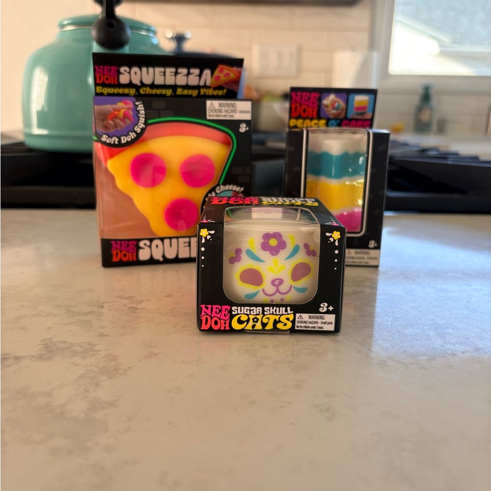 NeeDoh Sugar Skull Cat, Pizza, and Cake! Toy Set - White, Yellow, Pink, Blue